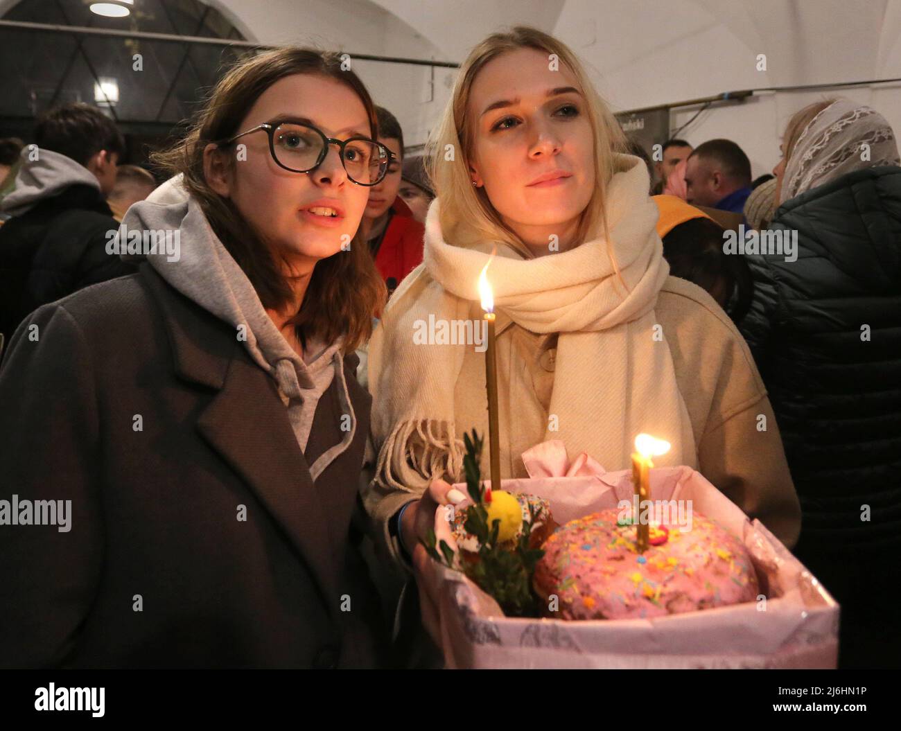 Cracow. Krakow. Poland. Ukrainian refugees and Cracow`s residents attending Easter midnight service from late Saturday night to early Sunday morning i Stock Photo
